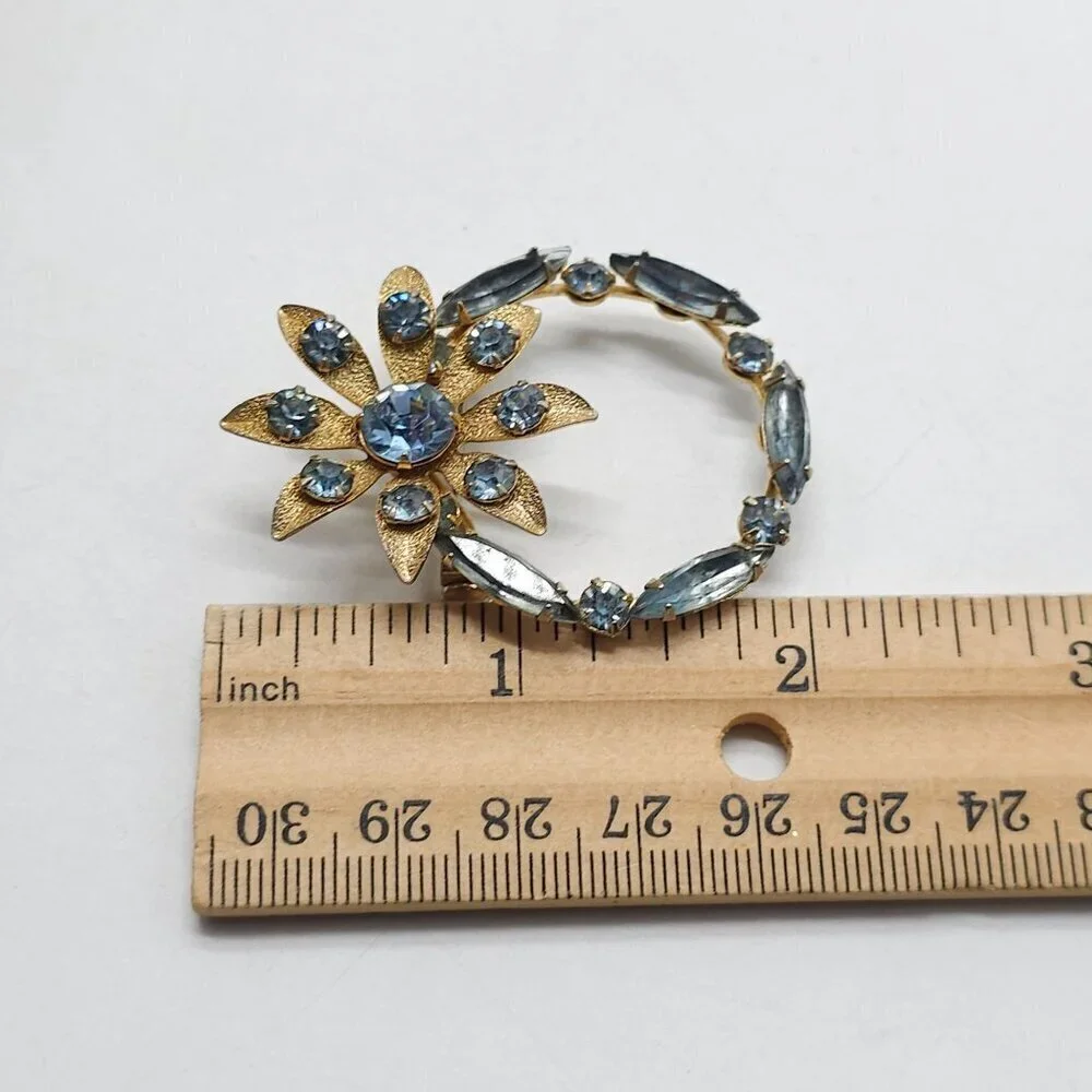 Vintage Gold Tone Brooch With Blue Rhinestones In Floral Design
